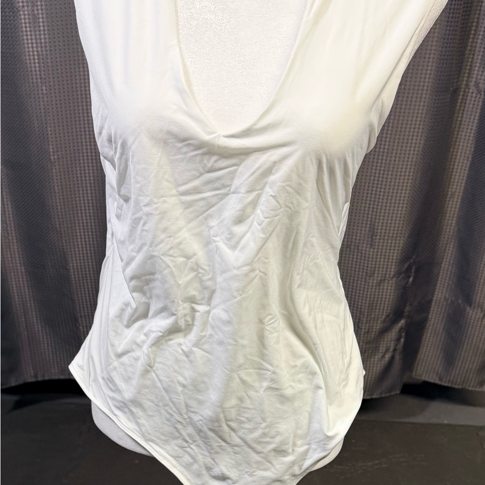 White v-neck tank style bodysuit.